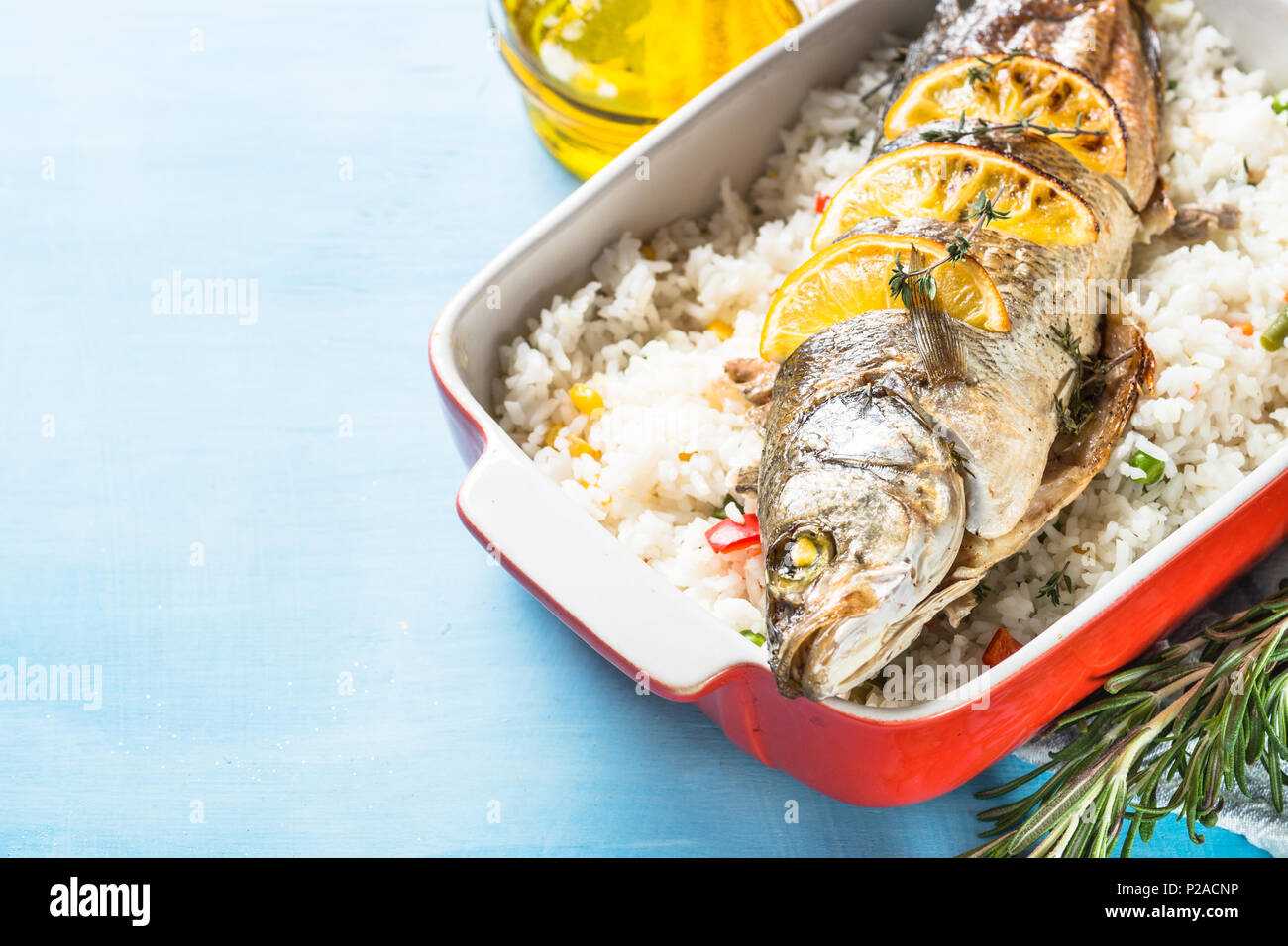 Pesce Branzino Al Forno Con Riso E Verdure Foto Immagine Stock