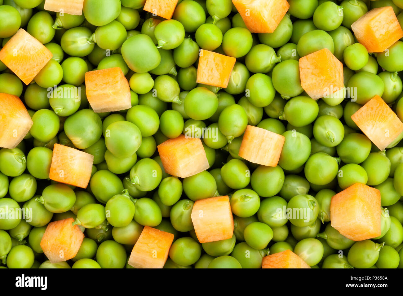 Piselli e carote texture di sfondo Foto Stock