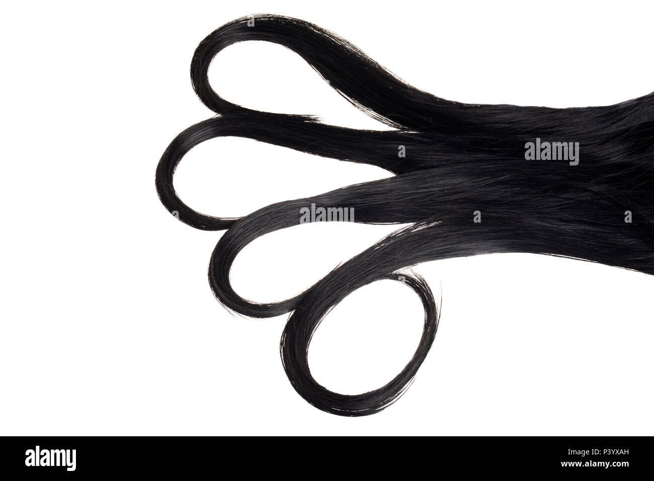 Pezzo di capelli neri con riccioli di loop isolato Foto Stock