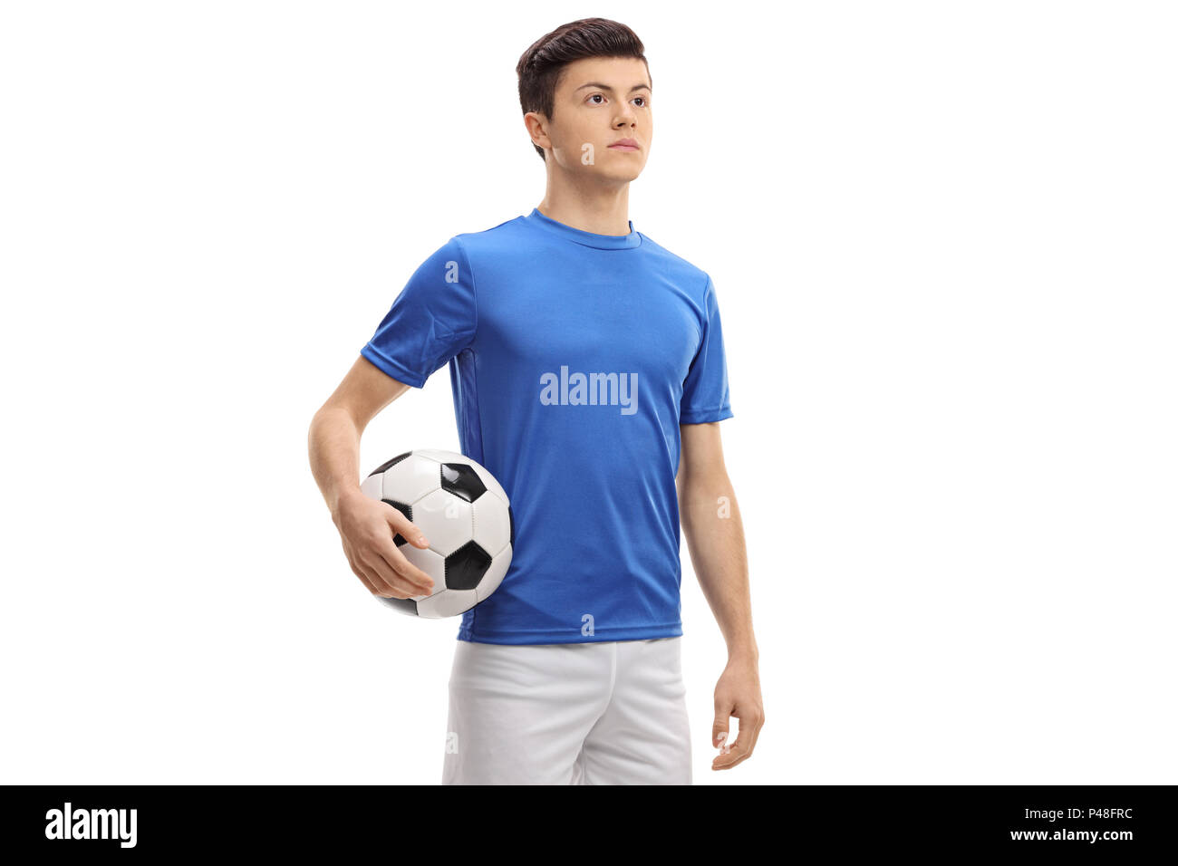 Teenage giocatore di calcio isolati su sfondo bianco Foto Stock