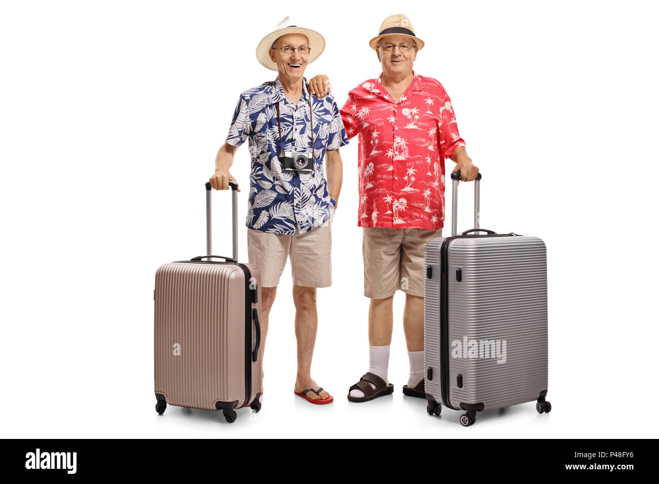 A piena lunghezza ritratto di due anziani turisti con valigie isolati su sfondo bianco Foto Stock