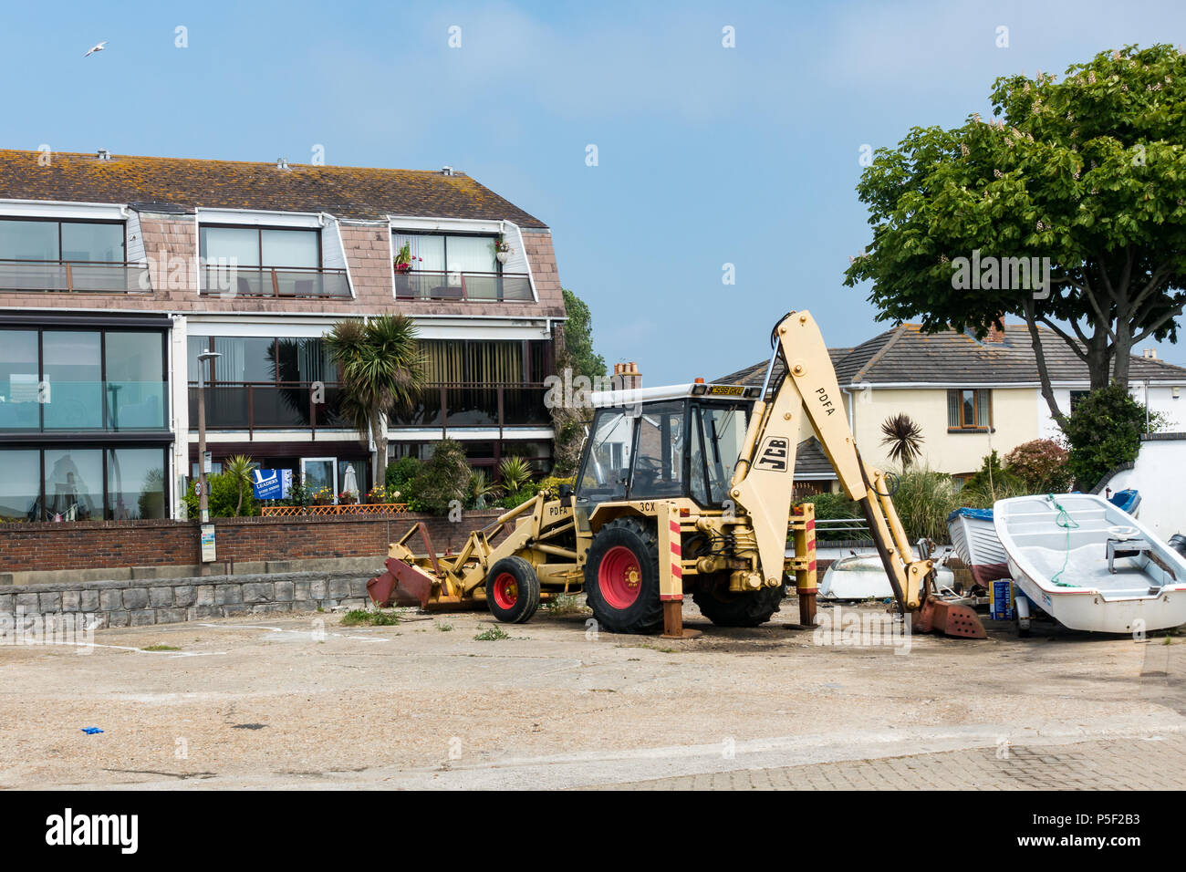 Un fermo JCB escavatore digger, Poole, Dorset, Regno Unito Foto Stock