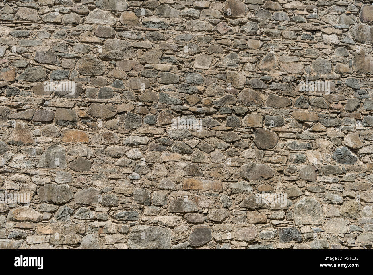 Muro di pietra di un vecchio castello Foto Stock