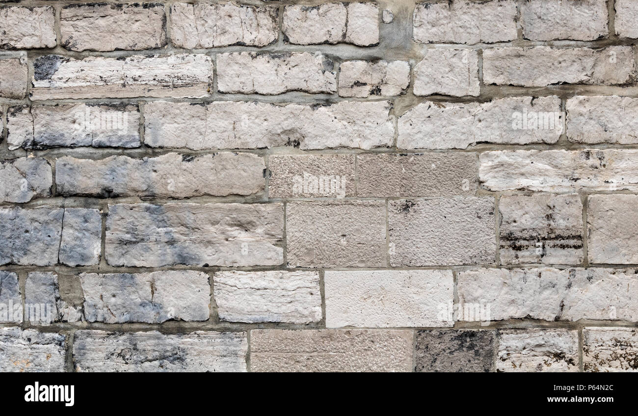 Calcestruzzo parete di mattoni leggermente danneggiato Foto Stock