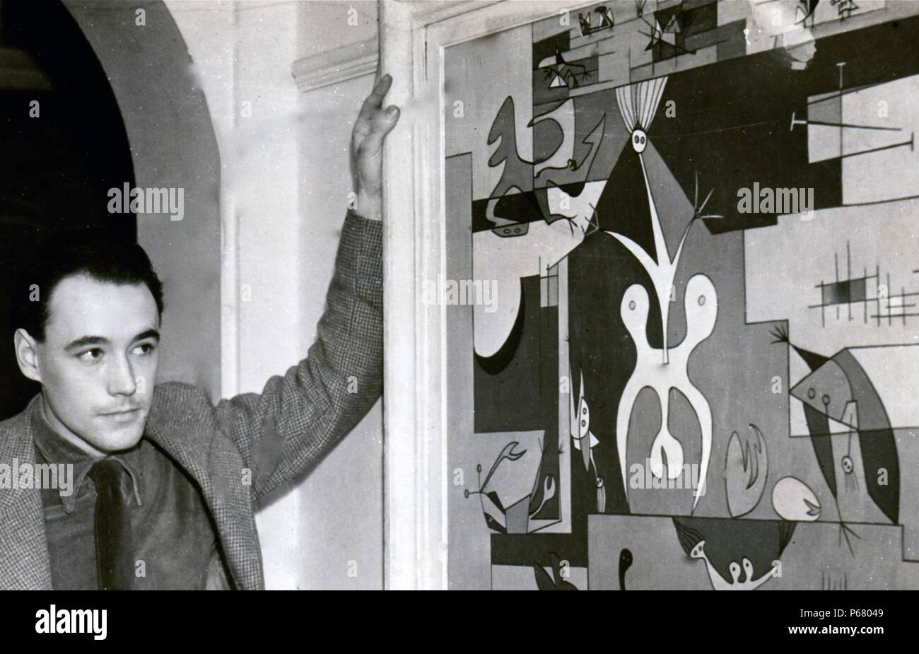 Desmond Morris con la sua paitng 'città' alla sua prima mostra a Londra presso la London Gallery gestito da Edourd Mesens. 1950. Foto Stock