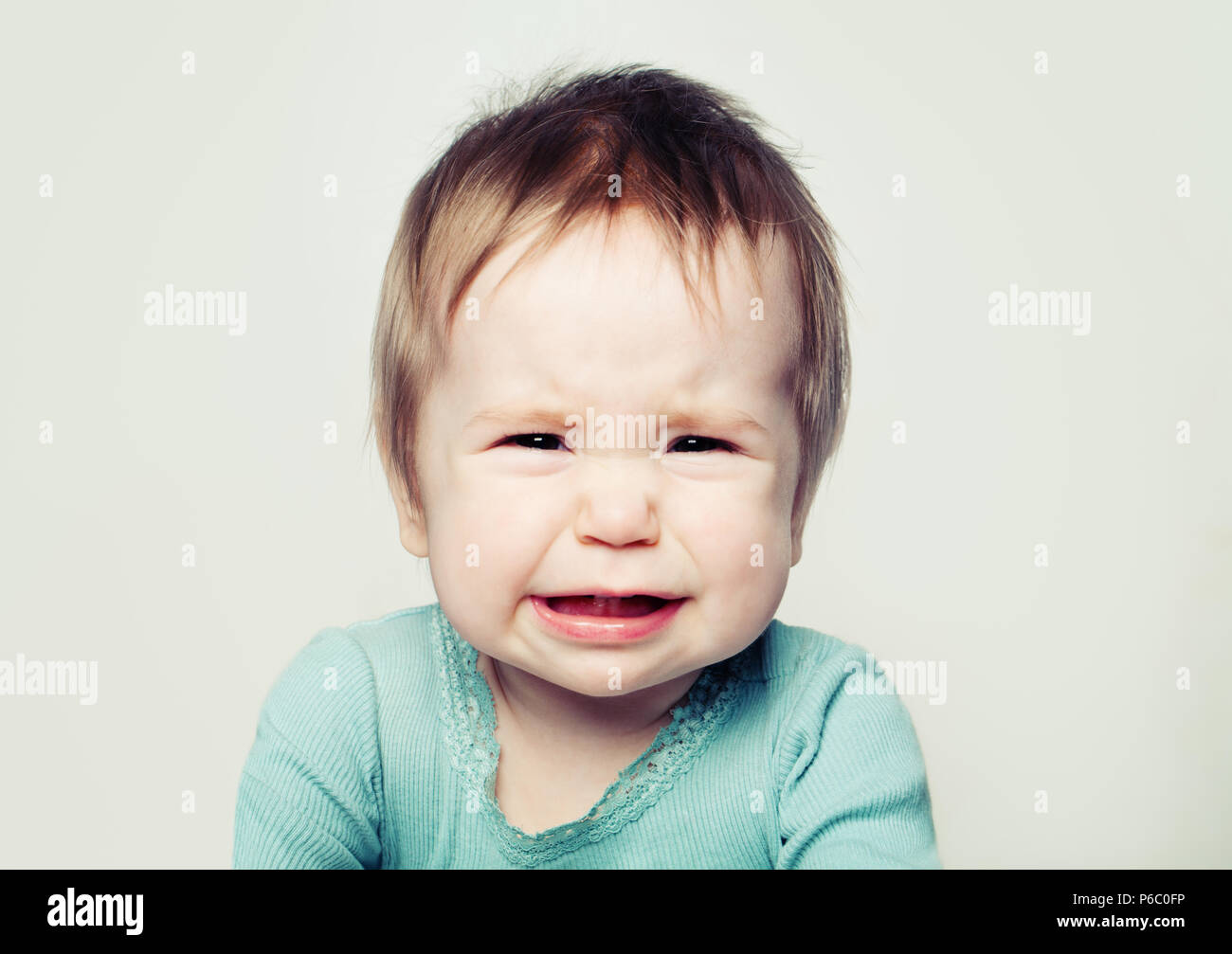 Gridando bambino faccia (6 mesi). Foto Stock