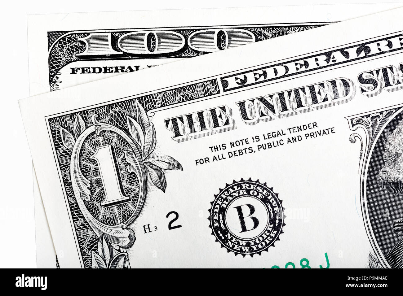 Dettagli di 1 estremità 100 fatture del dollaro, isolato su bianco. Foto ad alta risoluzione. Foto Stock