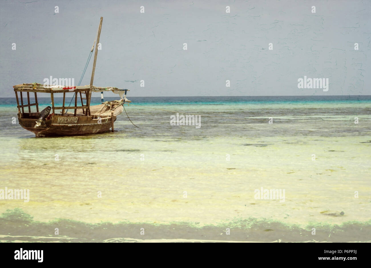 Zanzibar pesca tradizionale dhow vela , barche da pesca cordato con la bassa marea sulla costa di Zanzibar Foto Stock