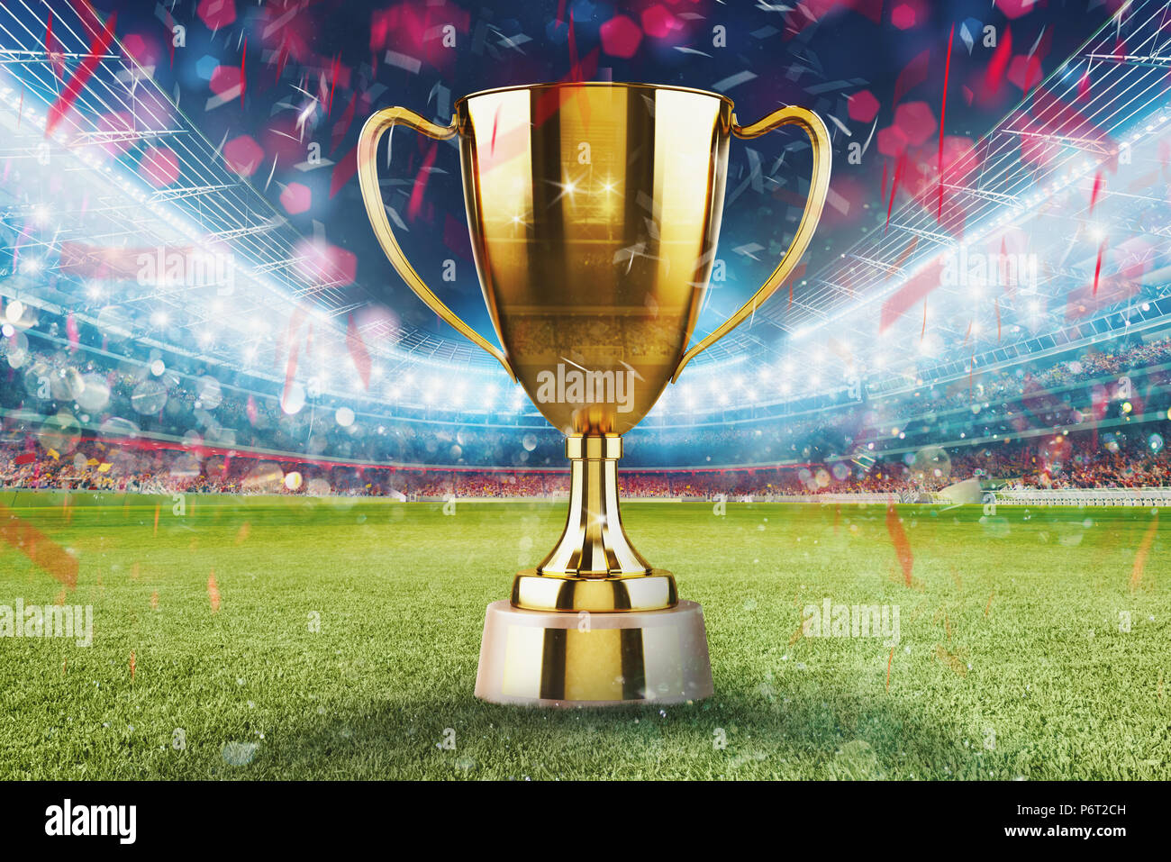 Golden vincitore s cup nel mezzo di uno stadio di calcio con il pubblico Foto Stock