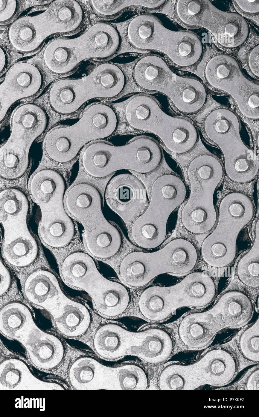 Abstract texture di sfondo del vecchio e sporco e catena a rulli per motocicletta. Vista dall'alto. Foto Stock