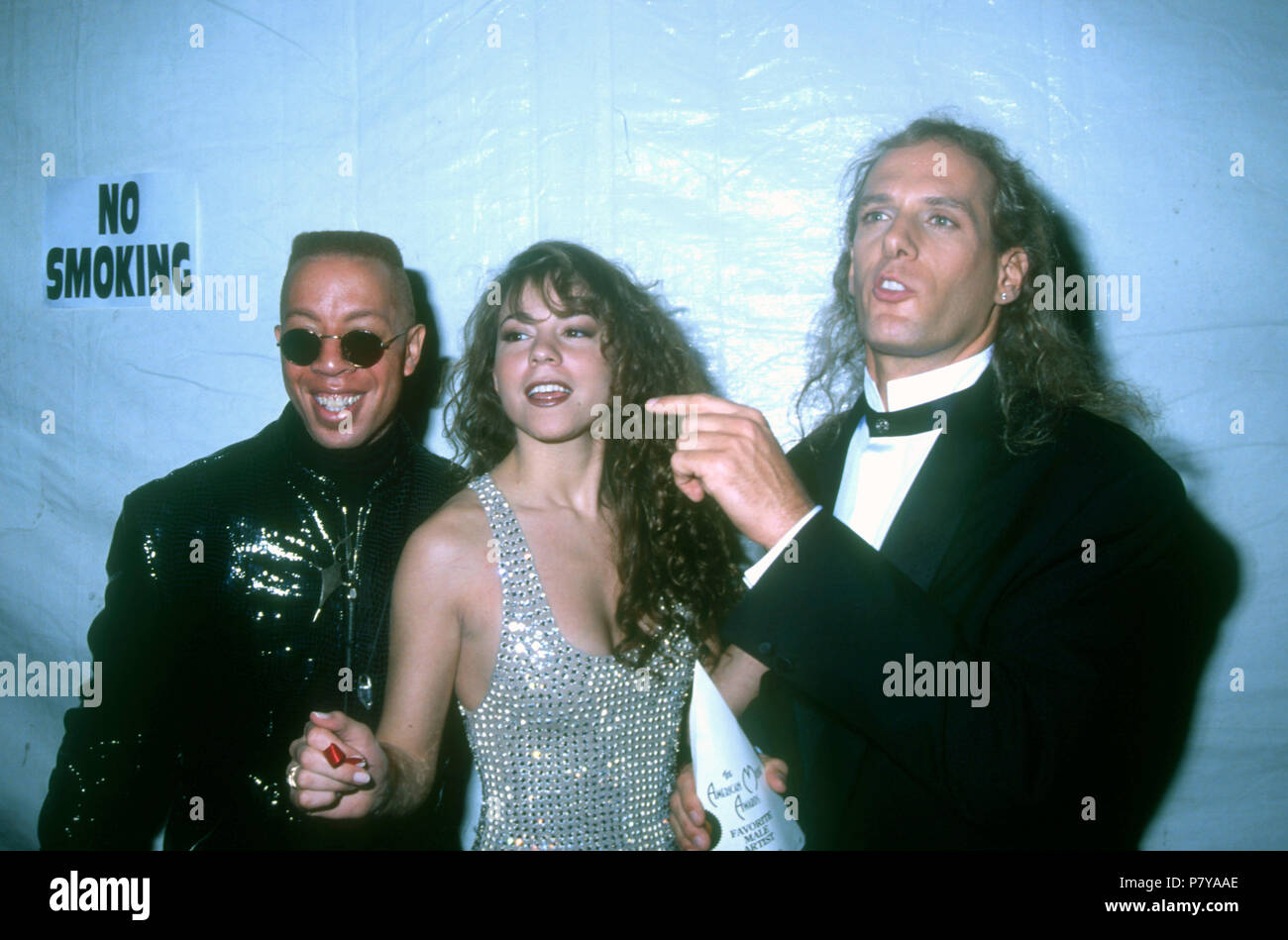 LOS ANGELES, CA - gennaio 27: (l-R) musicista David Cole, cantanti Mariah Carey e Michael Bolton frequentare il xix American Music Awards il 27 gennaio 1992 presso lo Shrine Auditorium di Los Angeles, California. Foto di Barry re/Alamy Stock Photo Foto Stock