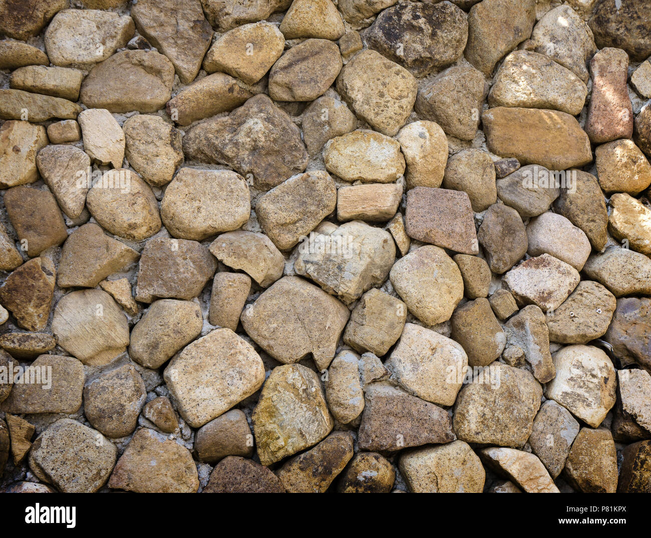 Sfondo giallo della parete di roccia in pietra. Foto Stock