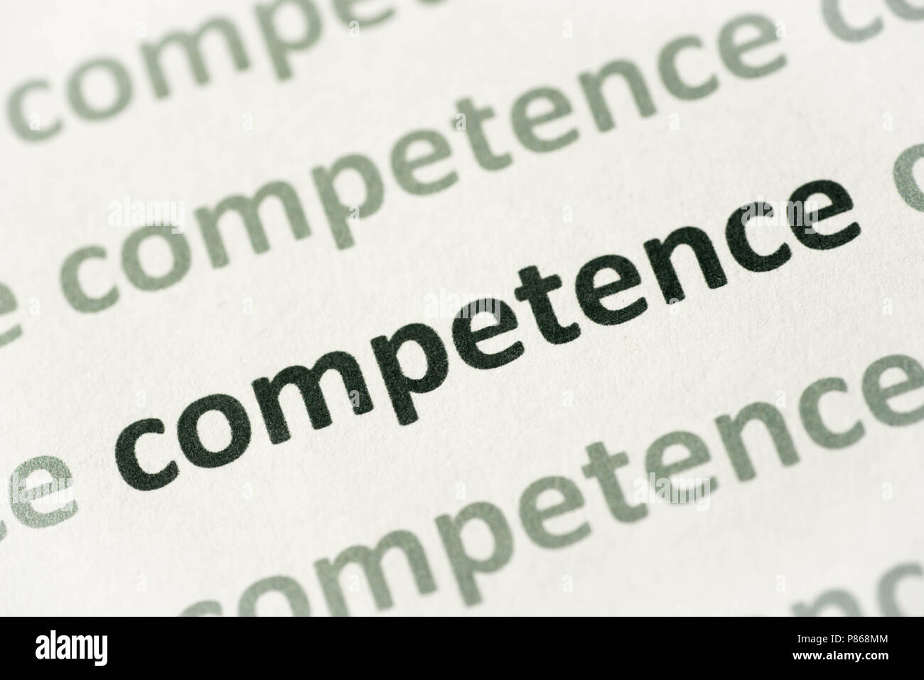 La competenza di parola stampata su carta bianca macro Foto Stock