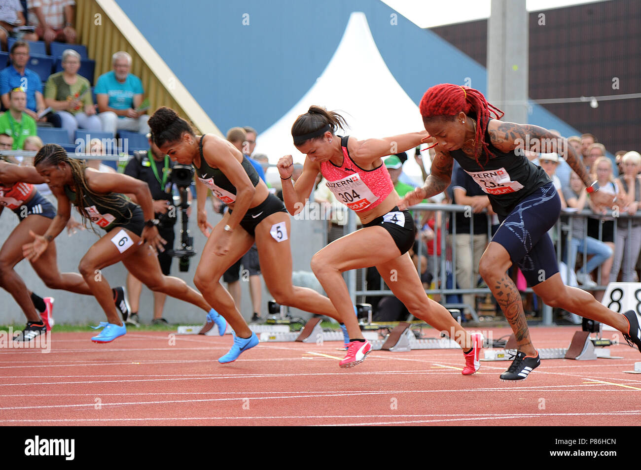 Stadion Allmend, Lucerna, Svizzera. 9 Luglio, 2018. Spitzen Leichtathletik Luzern atletica; Michelle-Lee Ahye (TRI), Jenna Prandini (USA), Mujinga Kambunji (SUI) e Shelly-Ann Fraser-Pryce (JAM) in azione durante le Donne 100m credito evento: Azione Plus sport/Alamy Live News Foto Stock