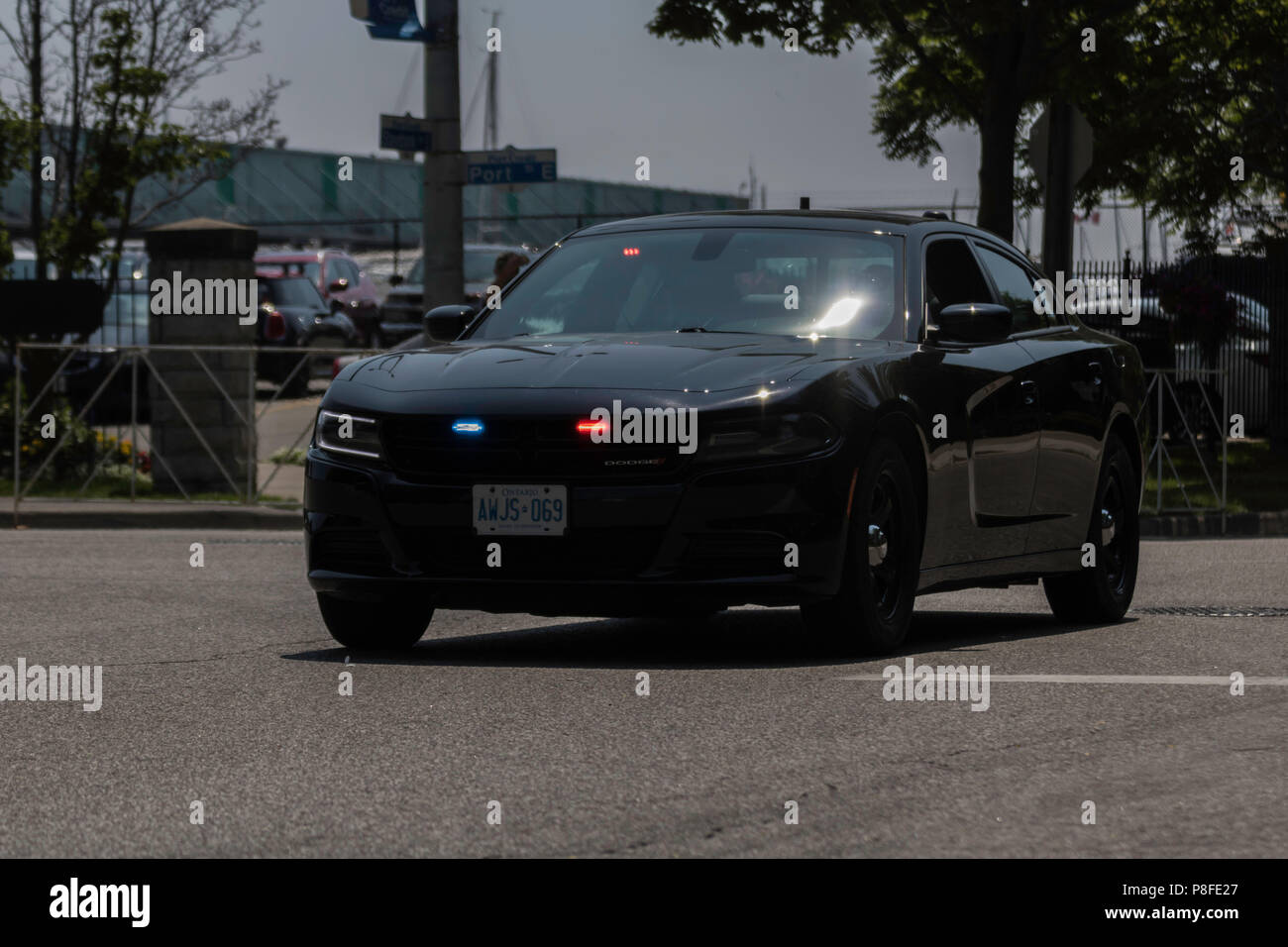Scorta di polizia la chiusura del Canada parata del giorno celebrazione nel porto di credito, Ontario, Canada Foto Stock