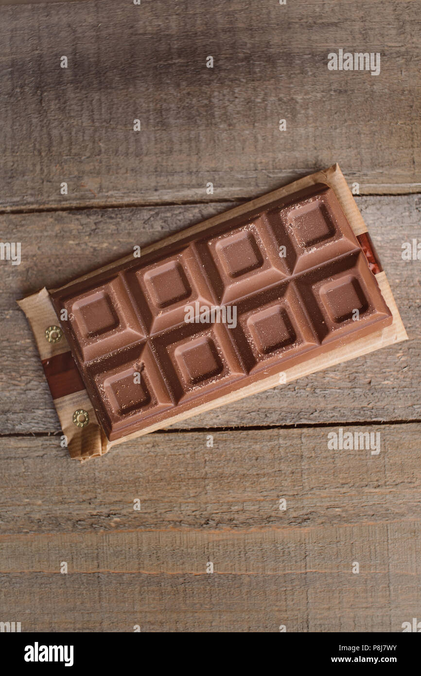 Cioccolato sulla tavola di legno Foto Stock