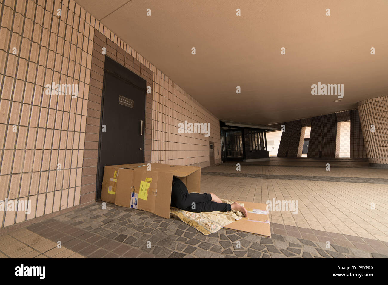 Poveri senzatetto in strada di Hong Kong Foto Stock