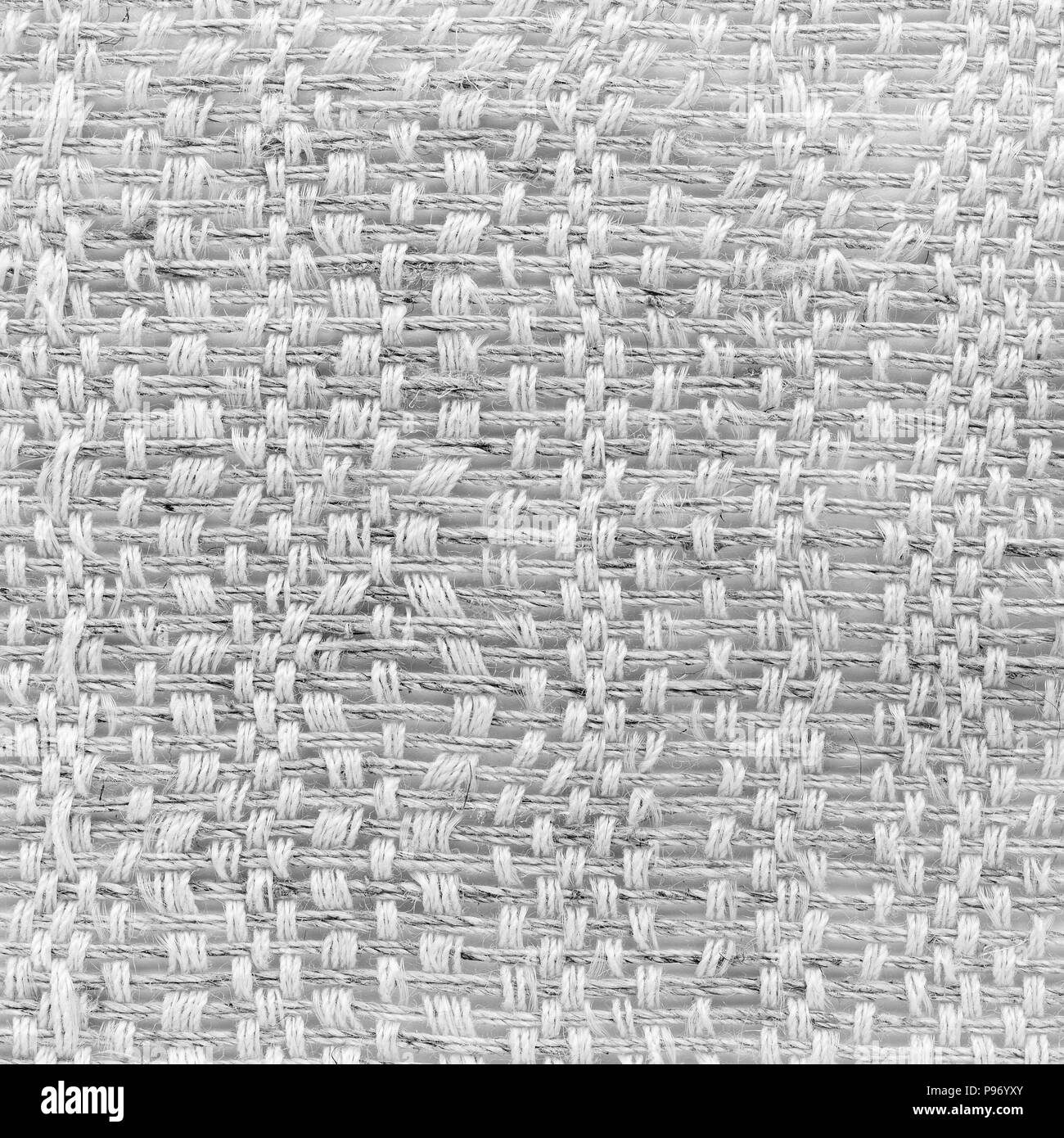 White tessitura a mano matting tessuto tweed texture. Closeup frammento quadrato Foto Stock