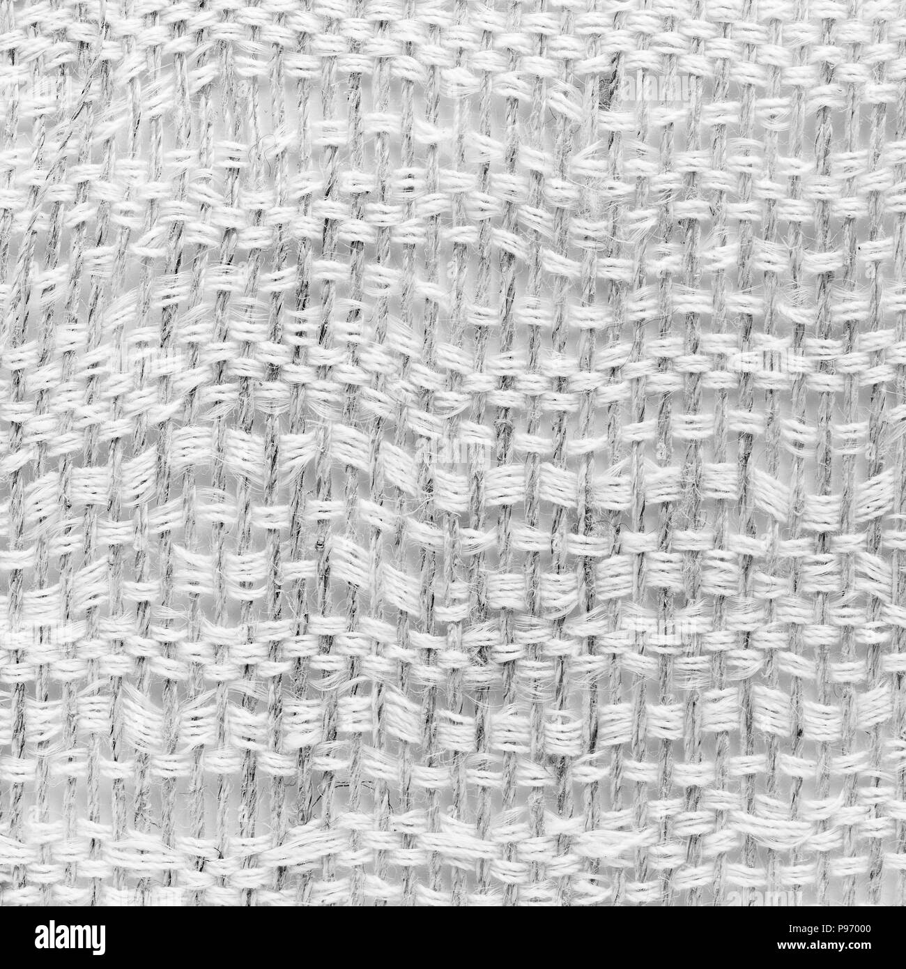 White tessitura a mano matting tessuto tweed texture. Closeup frammento quadrato Foto Stock