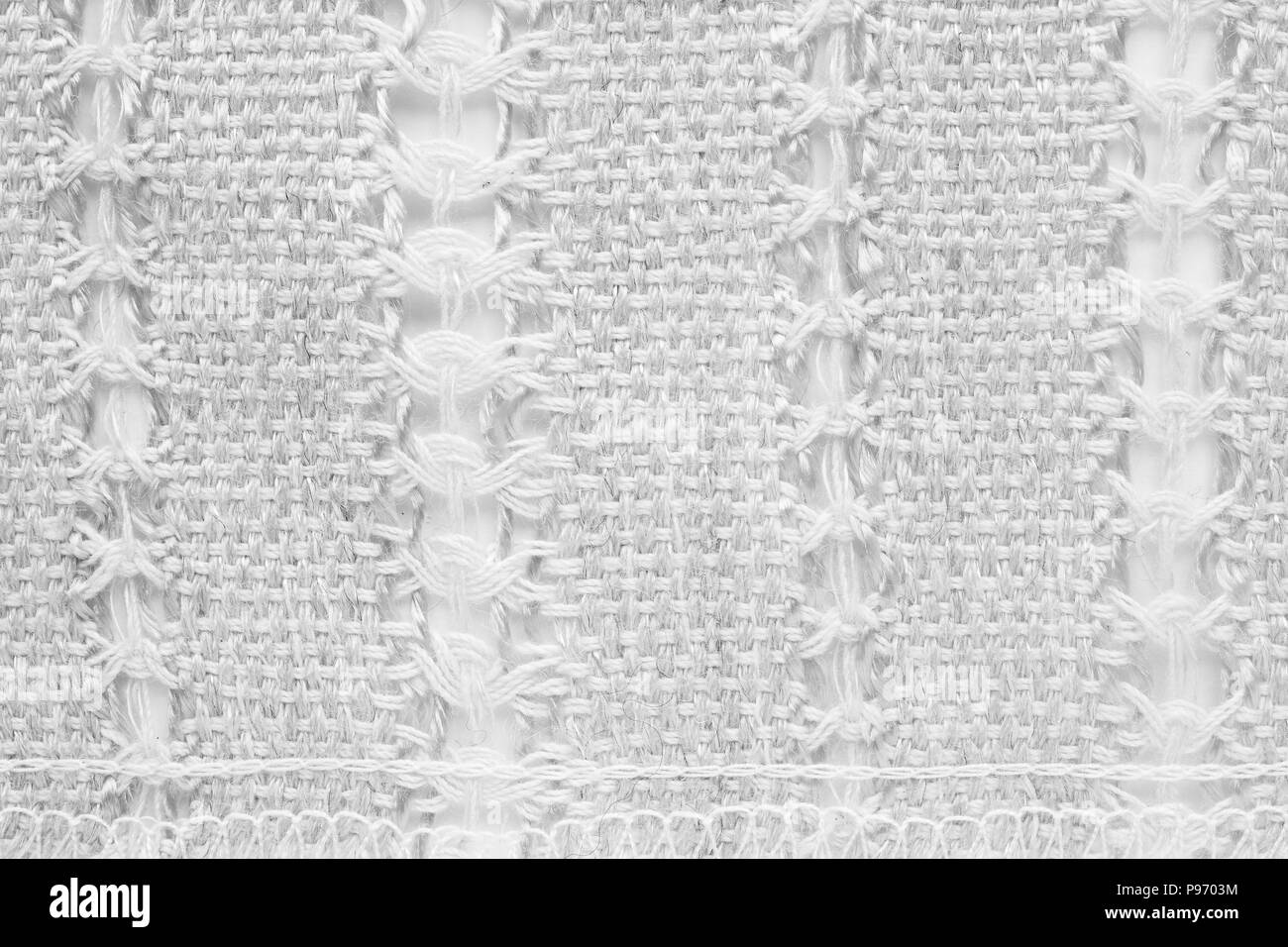 White tessitura a mano matting tessuto tweed texture. Closeup frammento orizzontale Foto Stock
