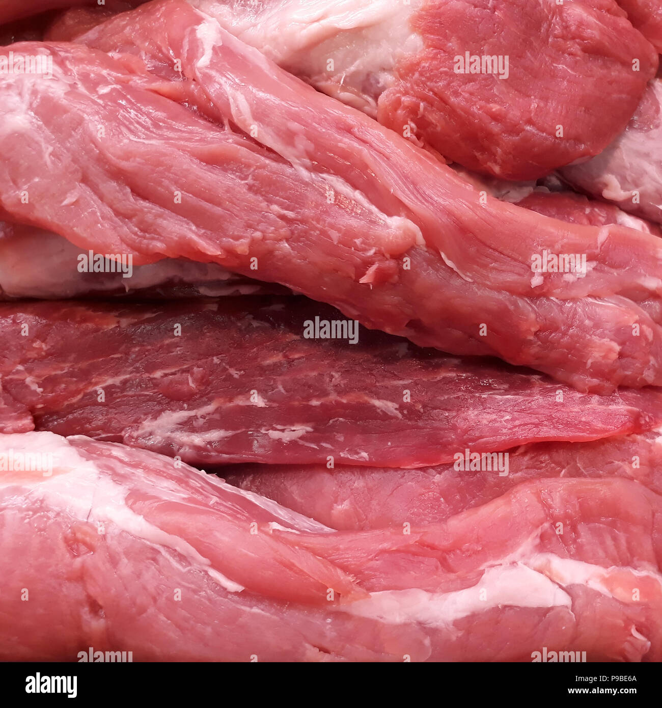 Pezzi di crudo fresco di filetti di maiale closeup, può essere utilizzato come sfondo o texture Foto Stock