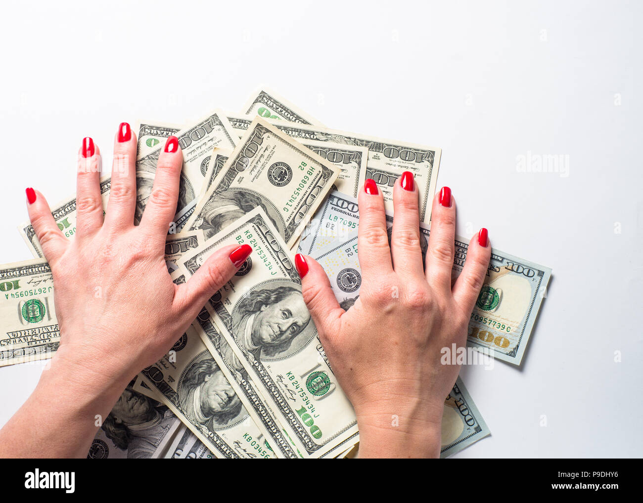 Il denaro dollaro e la donna le mani. Concezione della ricchezza e ricco. Foto Stock