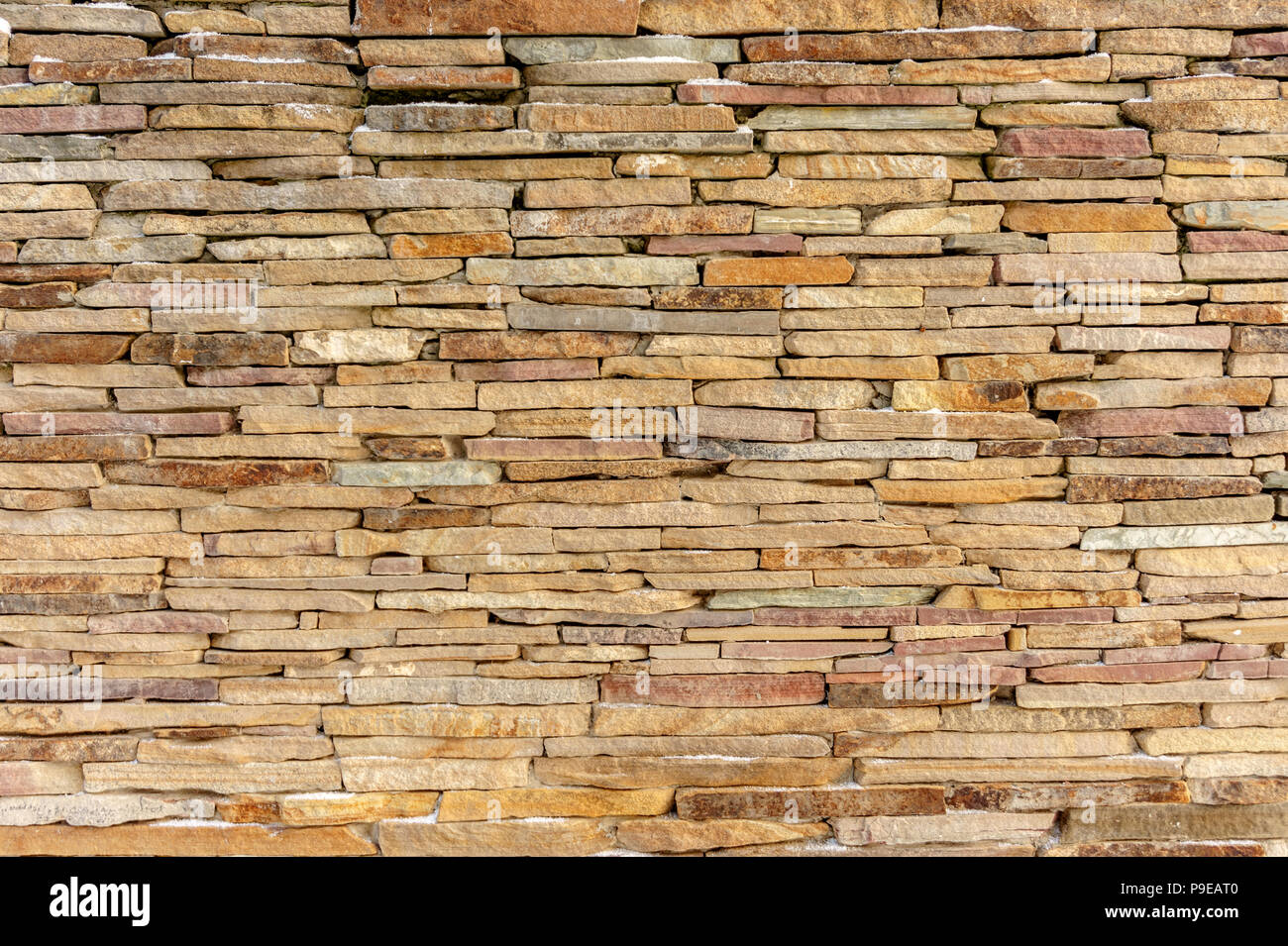 In mattoni di pietra arenaria muro di pietra sfondo texture Foto Stock