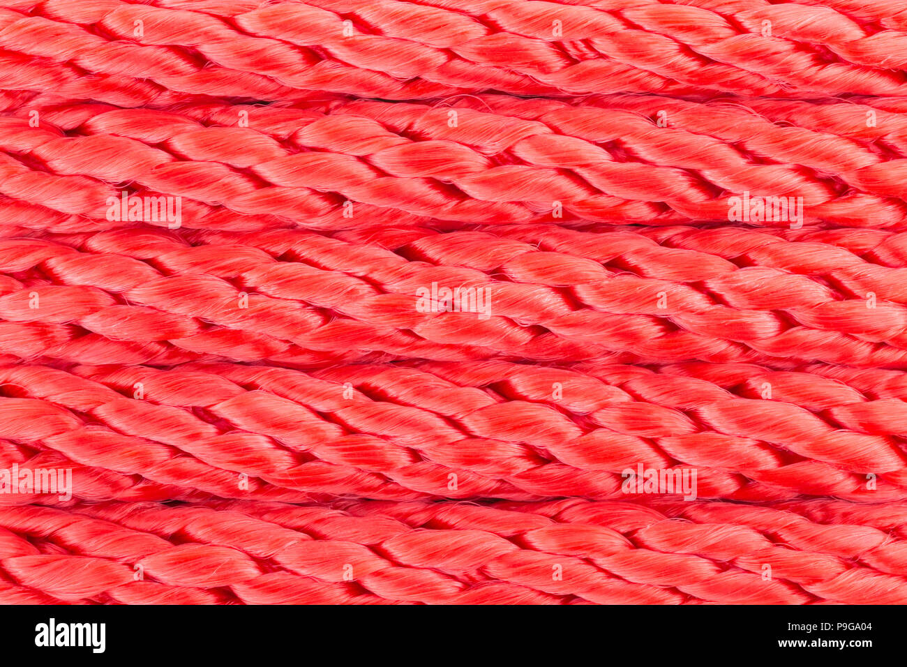 In Nylon rosso sfondo della fune per il design. Funi in nylon background in vista ravvicinata. Foto Stock