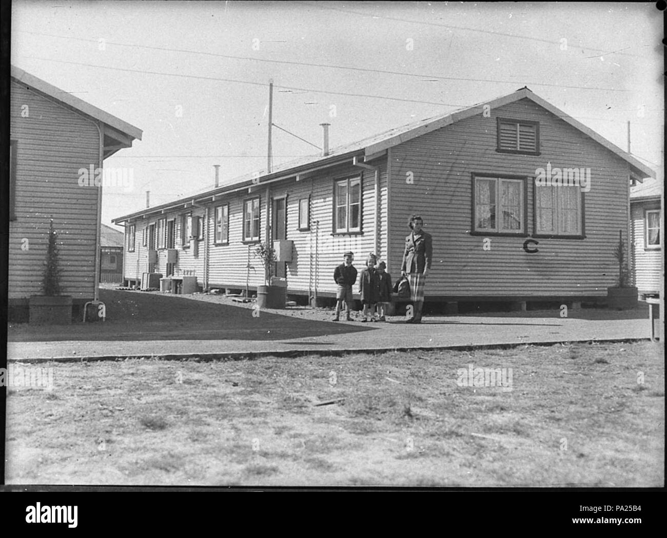 256 31261 SLNSW inglese migranti nello Stato Dockyard appartamenti Foto Stock