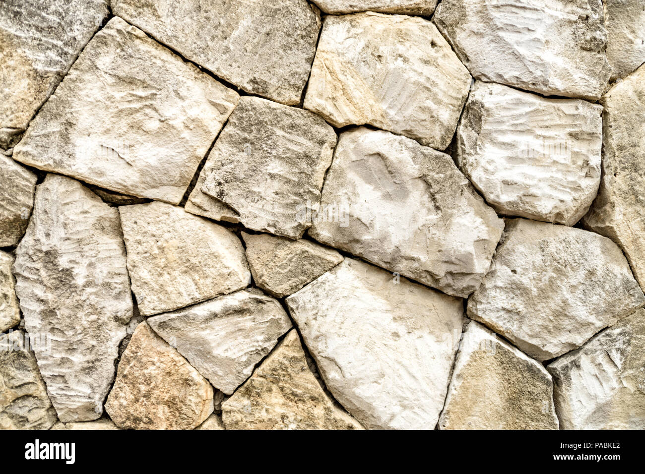 Intagliato a mano il blocco di pietra arenaria texture muro sfondo. Foto Stock