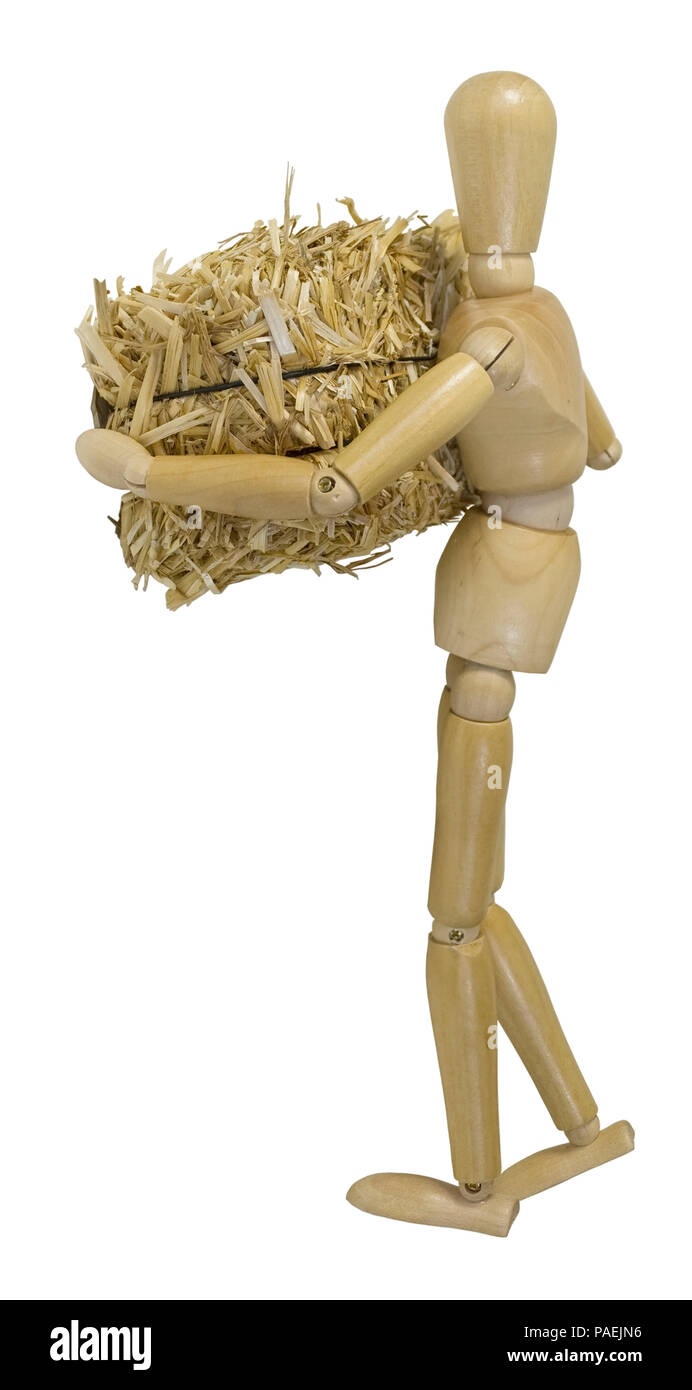 Portando una grande balla di bundle di fieno giallo - percorso incluso Foto Stock