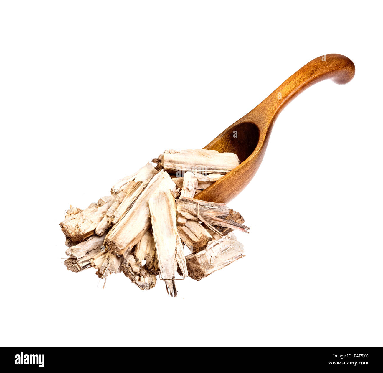 Bardana secco sul cucchiaio di legno. Foto Stock