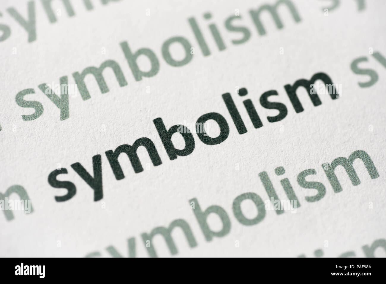Il simbolismo di parola stampata su carta bianca macro Foto Stock