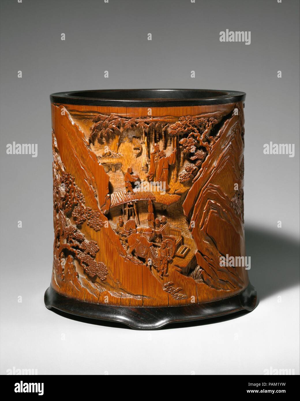 Il portaspazzole. Artista: Gu Jue (attivo tardo XVII secolo). Cultura: la Cina. Dimensioni: H. 7. (17,8 cm); D. 6 1/2 in. (16,5 cm). Questo porta spazzola illustra le scene del famoso poema "Ode al padiglione della inebriato Vecchio" da Ouyang Xiu (1007-1072). Retrocesso in 1045 per il telecomando della provincia di Anhui, Ouyang ha preso conforto in vino e il mondo naturale. Museo: Metropolitan Museum of Art di New York, Stati Uniti d'America. Foto Stock