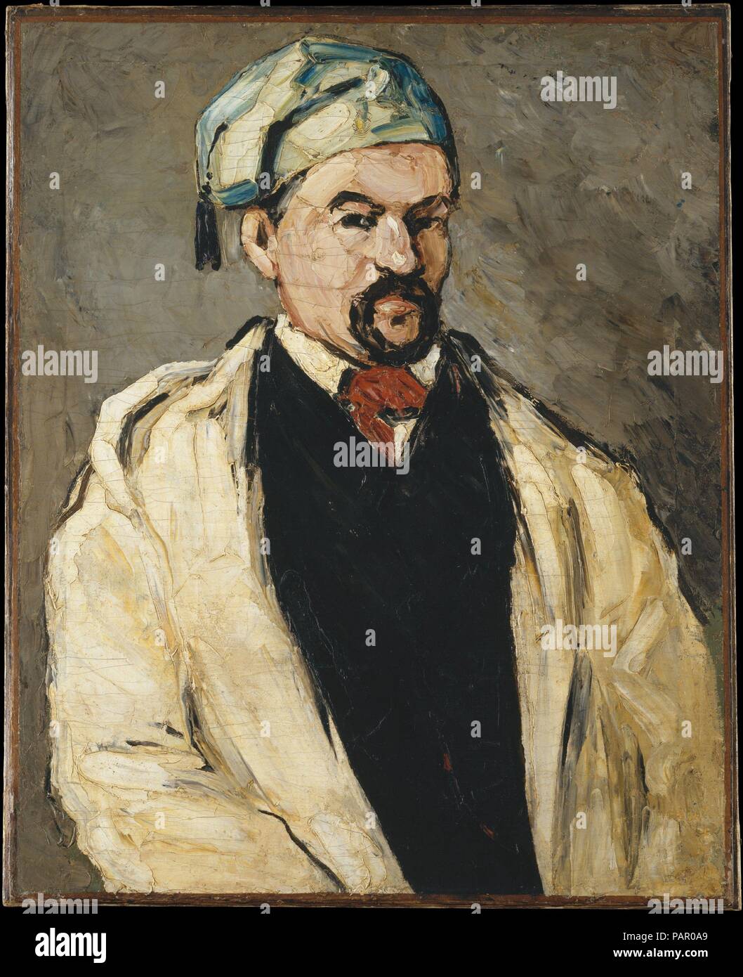 Antoine Dominique Sauveur Aubert (nato 1817), l'artista lo zio. Artista: Paul Cézanne (francese, Aix-en-Provence 1839-1906 Aix-en-Provence). Dimensioni: 31 3/8 x 25 1/4 in. (79,7 x 64,1 cm). Data: 1866. Nell'autunno del 1866, durante il suo soggiorno presso la sua famiglia, la casa vicino a Aix-en-Provence, Cézanne ha intrapreso una serie di dipinti di suo zio materno, Dominique Aubert, in costumi diversi. Qui egli indossa una tunica e tasseled tappo blu; in un'altra opera nella collezione del museo, egli si pone come un monaco (1993.400.1). Un amico ha riferito nel novembre: 'Ogni giorno vi appare una [Nuovo] ritratto di lui.' Cézanne una Foto Stock