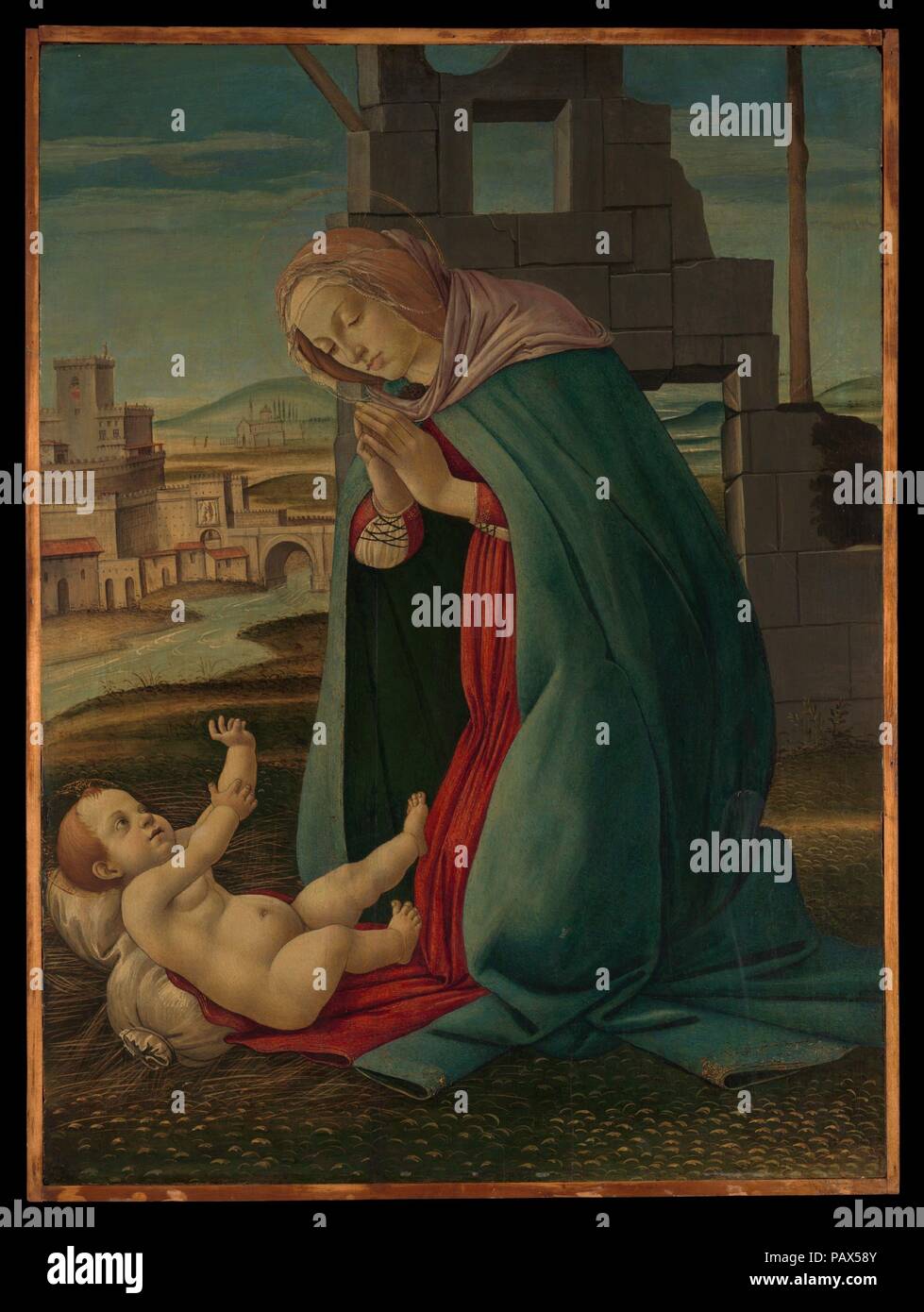 La natività. Artista: Workshop di Botticelli (italiano, Fiorentina, 1444/45-1510). La cultura italiana, Firenze. Dimensioni: 30 1/2 x 22 1/2 in. (77,5 x 57,2 cm). Data: tardo XV secolo. La Vergine si inginocchia in adorazione davanti a Cristo Bambino, con il suo manto azzurro fissato da un fermaglio in forma di un cherubino, mentre la stella d'oro sulla sua spalla sinistra allude al suo titolo come 'Stella Maris' (stella di mare), evocando la luce guida essa offre. A metà distanza appare il Castel Sant'Angelo, mausoleo eretto sulle rive del fiume Tevere a Roma per l'imperatore Adriano tra 134 e Foto Stock La natività. Artista: Workshop di Botticelli (italiano, Fiorentina, 1444/45-1510). La cultura italiana, Firenze. Dimensioni: 30 1/2 x 22 1/2 in. (77,5 x 57,2 cm). Data: tardo XV secolo. La Vergine si inginocchia in adorazione davanti a Cristo Bambino, con il suo manto azzurro fissato da un fermaglio in forma di un cherubino, mentre la stella d'oro sulla sua spalla sinistra allude al suo titolo come 'Stella Maris' (stella di mare), evocando la luce guida essa offre. A metà distanza appare il Castel Sant'Angelo, mausoleo eretto sulle rive del fiume Tevere a Roma per l'imperatore Adriano tra 134 e Foto Stock