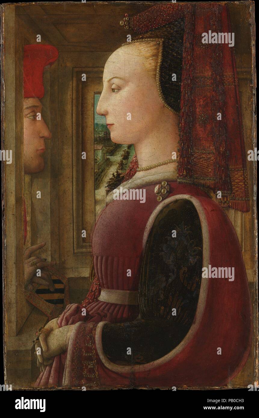 Ritratto di una donna con un uomo in un serramento. Artista: Fra Filippo Lippi (italiano, Firenze ca. 1406-1469 Spoleto). Dimensioni: 25 1/4 x 16 1/2 in. (64,1 x 41,9 cm). Data: ca. 1440. Questo è il più presto sopravvivendo doppio ritratto in Italia, il primo a mostrare il sitter in una impostazione interna e il primo con una vista su un paesaggio. La donna vestita lussuosamente <i>ala francese</i>, il suo manicotto ricamato con lettere ortografia "lealta' (fedeli), viene osservata da un uomo -- il suo fidanzato?--che appaiono in una finestra, le sue mani su un identificativo stemma. Le due figure possono essere Lorenzo di Ranieri S Foto Stock