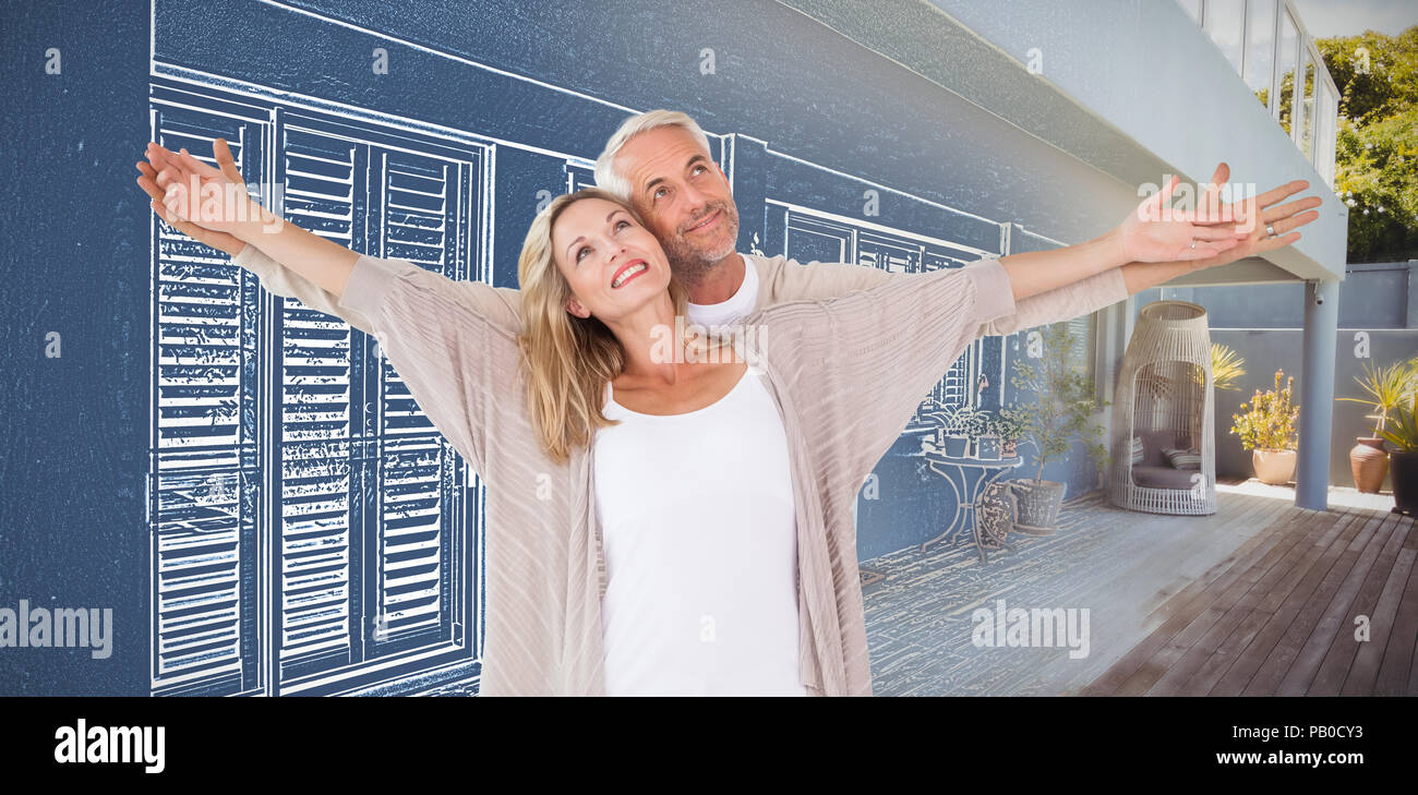 Immagine composita di allegro giovane con le braccia aperte Foto Stock