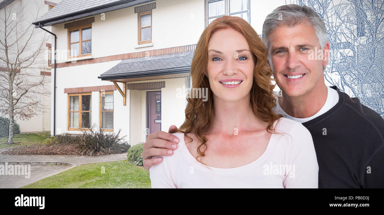 Immagine composita di casual Coppia sorridente in telecamera Foto Stock