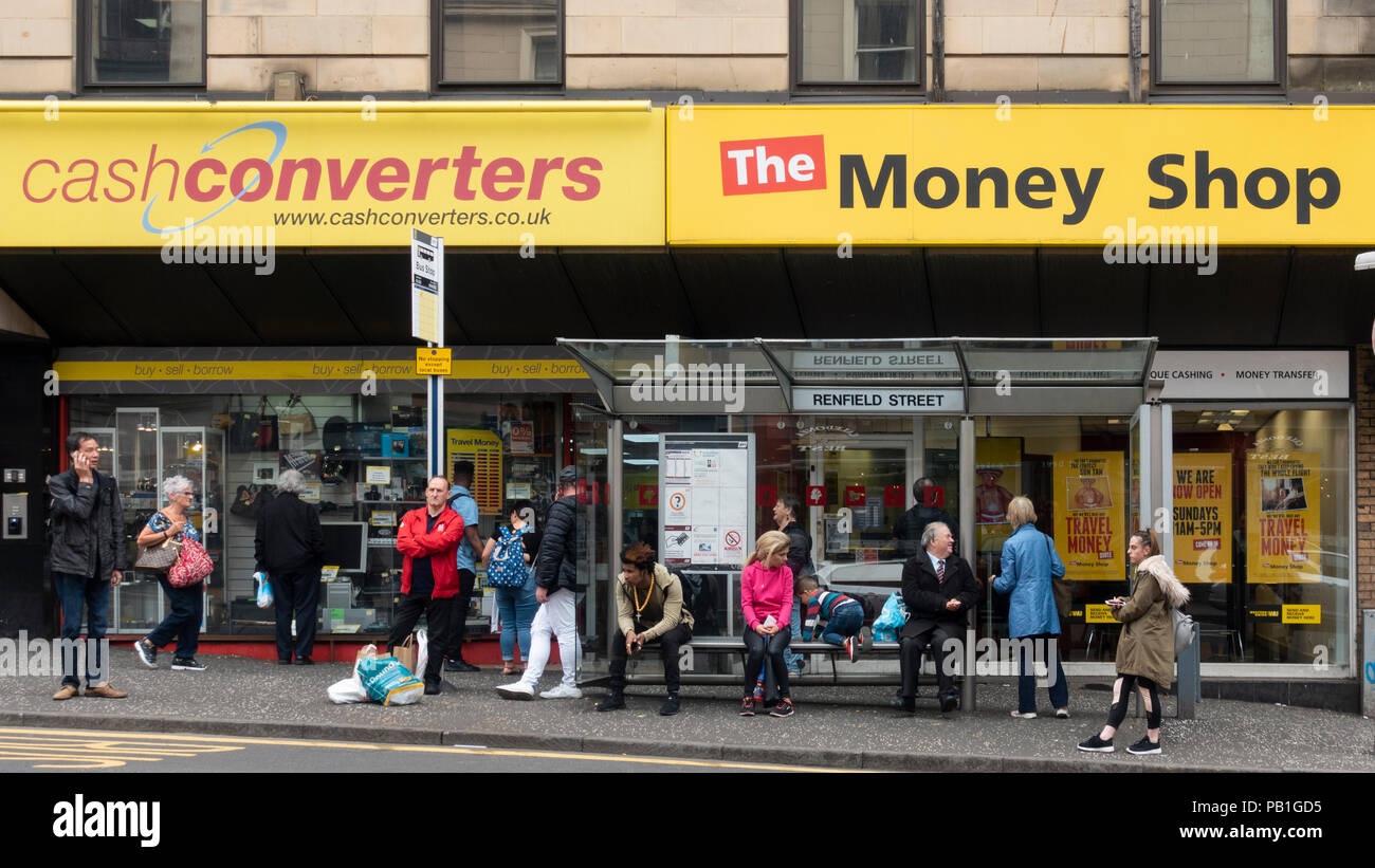 Esterno di due negozi che trattano in basso costo dei servizi di cassa, CashConverters e il denaro Shop nella zona centrale di Glasgow, Scotland, Regno Unito Foto Stock