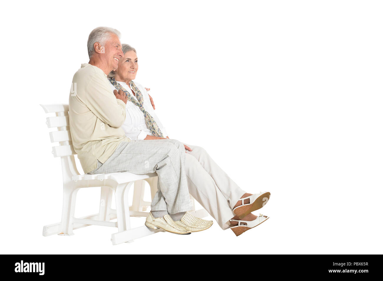 Ritratto di coppia senior seduta sul banco di lavoro Foto Stock