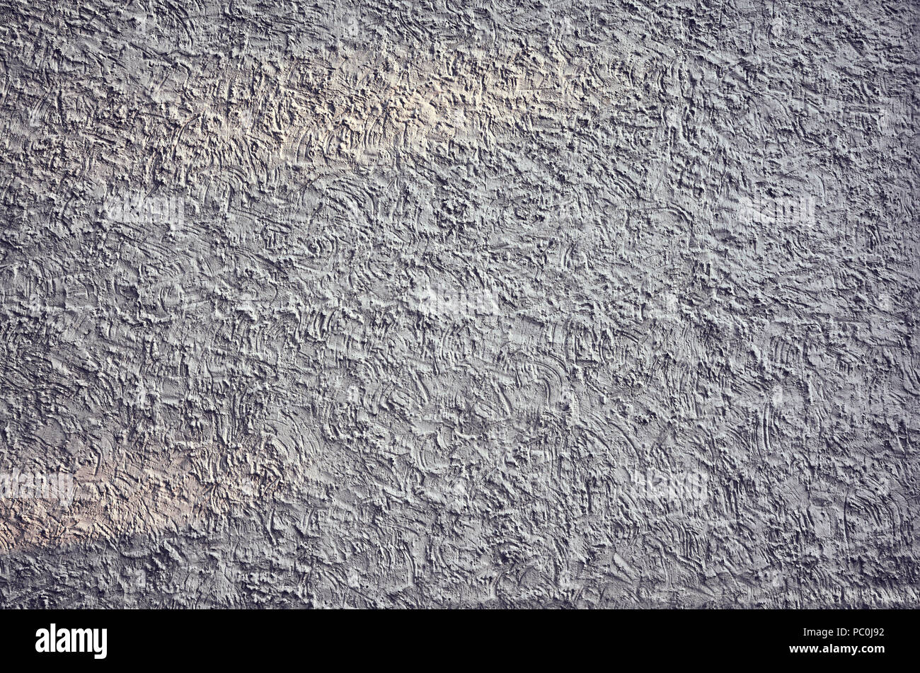 Grunge irregolare la superficie della parete, sfondo astratto o texture. Foto Stock