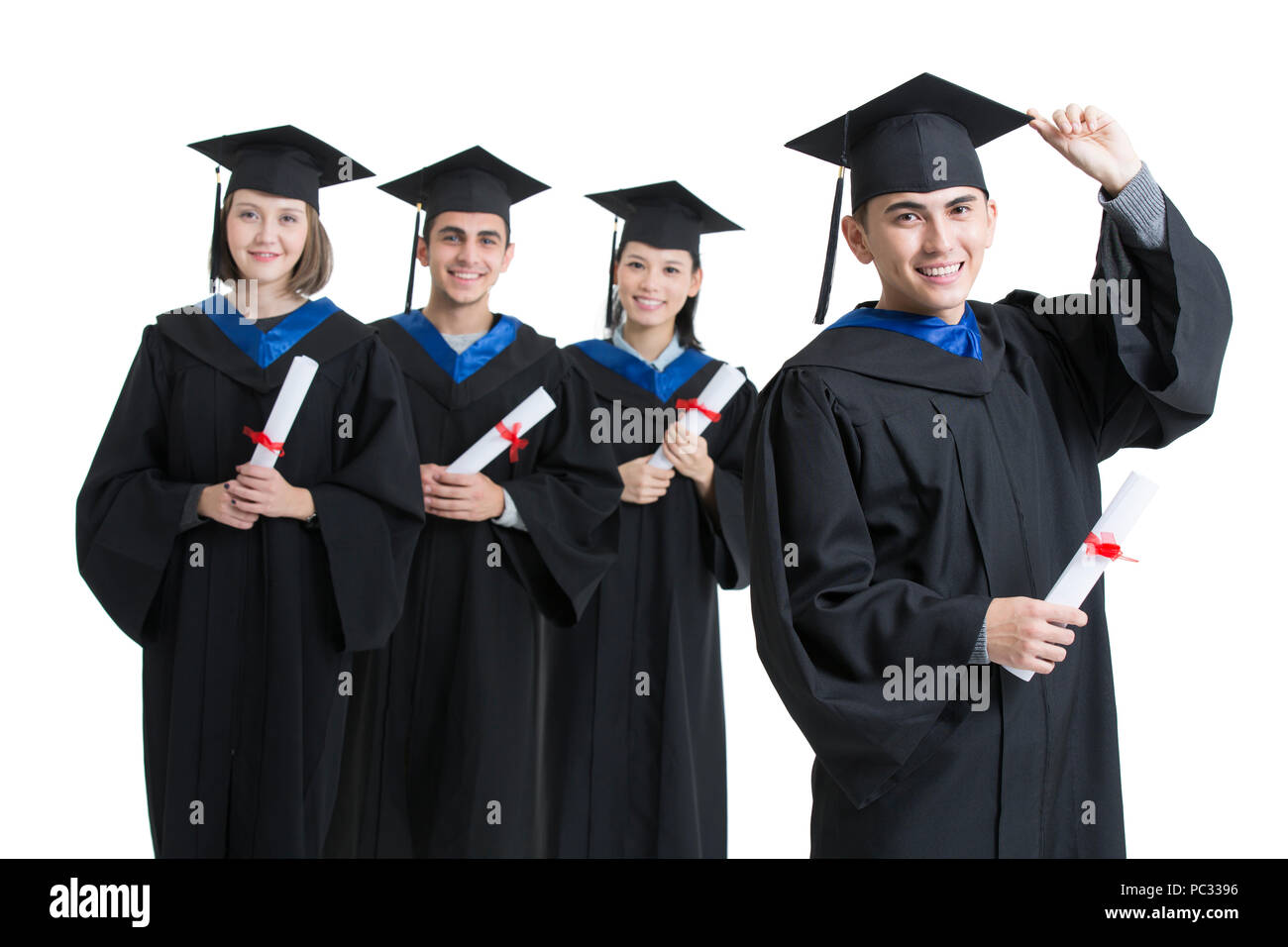 Felice laureati in abiti di graduazione Foto Stock