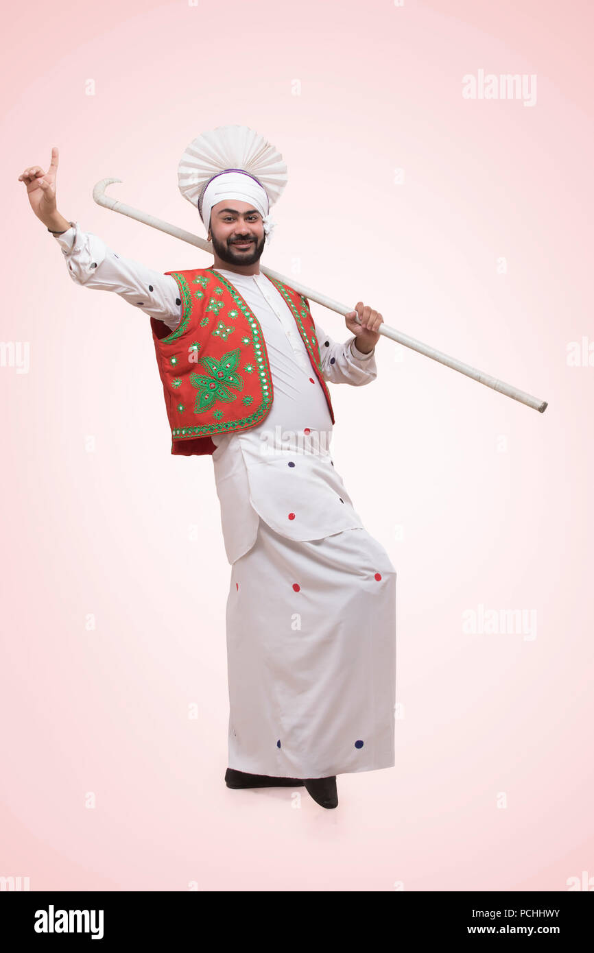 Posizione della religione Sikh uomo con bastone Foto Stock