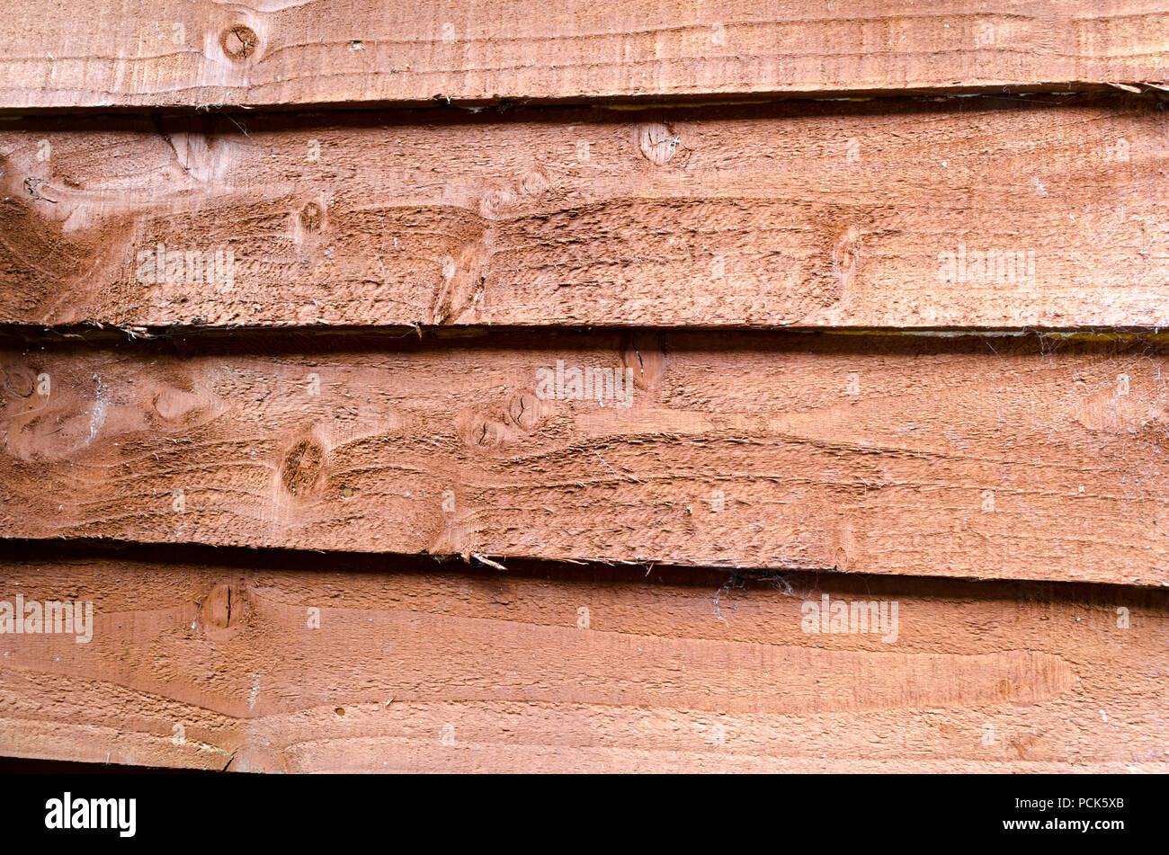 Uno sfondo marrone del legname di sovrapposizione Foto Stock