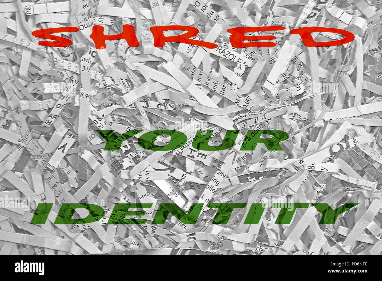 Le parole "hred la vostra identità" in grassetto e colorato tipo è sovrapposto su una fotografia in bianco e nero di bit di carta tagliuzzata da una famiglia shre Foto Stock