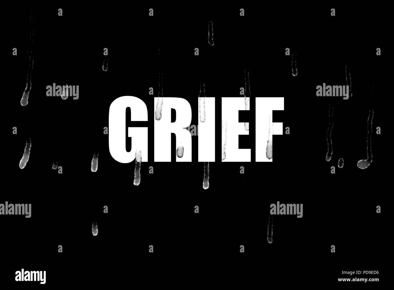 La parola " dolore " su sfondo nero con sentieri di lacrime sulle lettere in bianco e lo sfondo Foto Stock