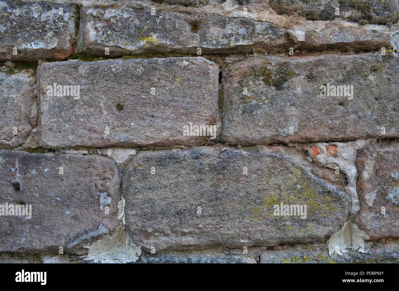 Il vecchio muro di pietra arenaria in formato carta da parati shot in Germania Foto Stock