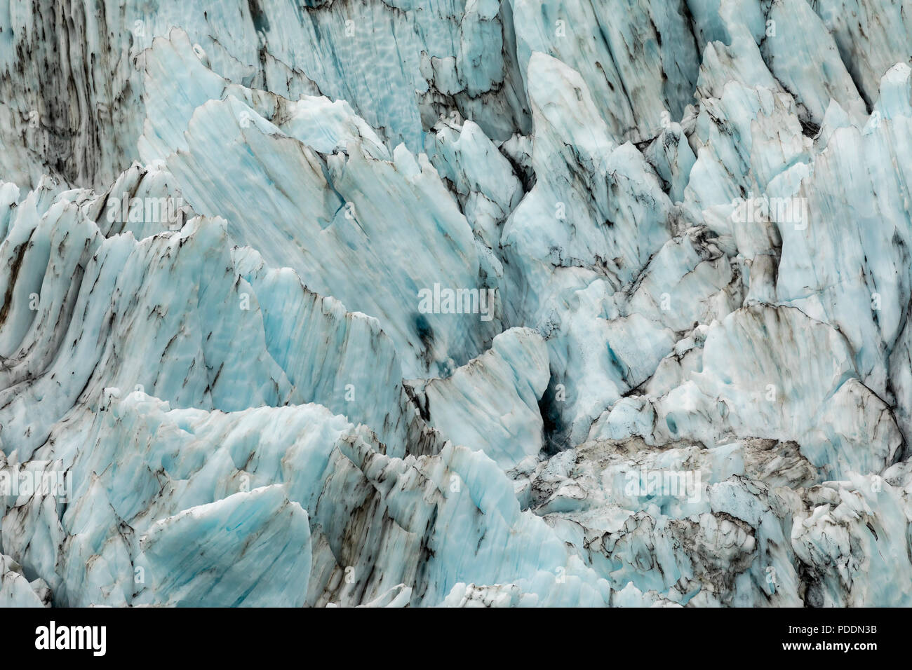 Striature di ghiaccio nel ghiacciaio di sorpresa in Prince William Sound in Alaska centromeridionale. Foto Stock
