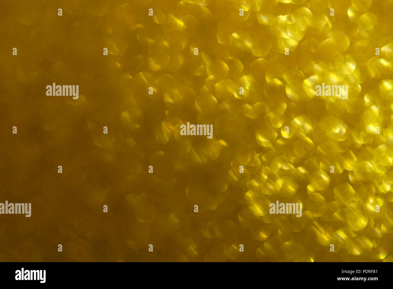Oro Lucido sfondo astratto con un effetto bokeh di fondo Foto Stock